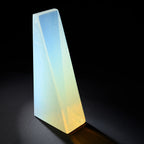 a web shape cast from opaline casting tint glass. color gradation from a warm golden yellow to a cool blue