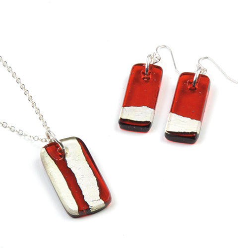 Red and white striped necklace and earrings on a white background